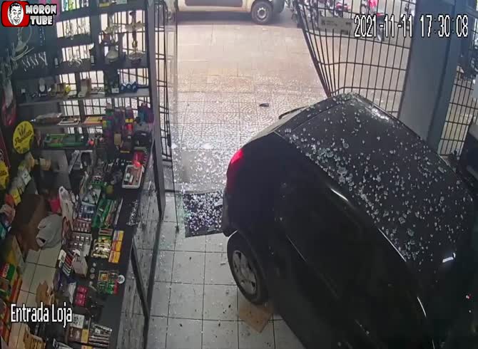 Video :A drugged motorist nearly strikes a shopper after smashing into a business